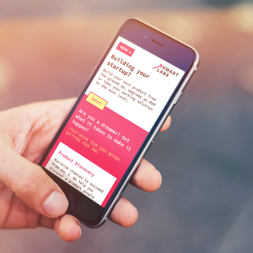 hand holding smartphone スマートラボ website mockup